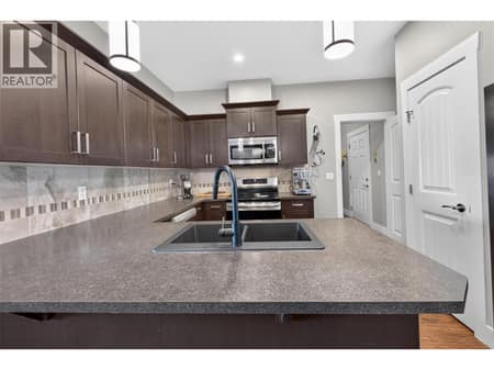 Well Equipped Kitchen with Pantry to the Right at 1040 Mt Revelstoke Place Unit# 14 Lot# 20, Middleton Mountain Vernon