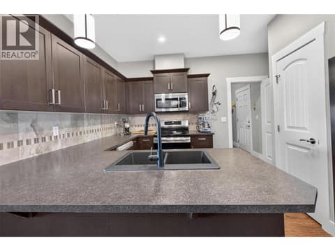 Well Equipped Kitchen with Pantry to the Right at 1040 Mt Revelstoke Place Unit# 14 Lot# 20, Middleton Mountain Vernon