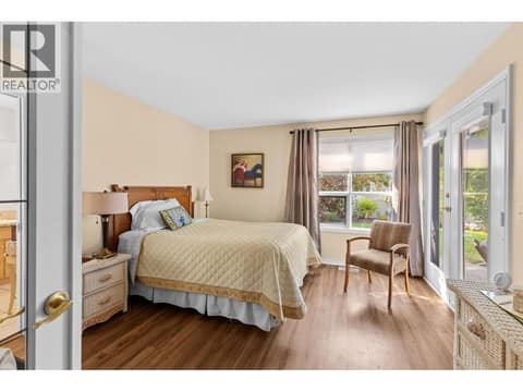 Bright primary bedroom with doors to outside private yard. at 4000 Gallaghers Terrace, South East Kelowna