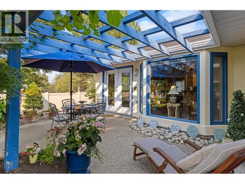 Deck view looking at kitchen & dining room. at 4000 Gallaghers Terrace, South East Kelowna