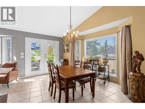Dining room with doors to private yard. at 4000 Gallaghers Terrace, South East Kelowna
