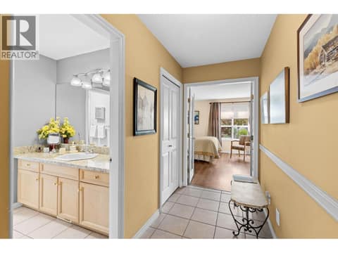 French doors leading to primary bedroom.  Bathroom. at 4000 Gallaghers Terrace, South East Kelowna