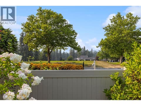 View over fence looking at Clubhouse. at 4000 Gallaghers Terrace, South East Kelowna
