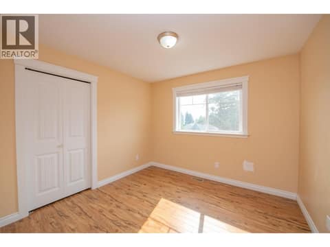 Second bedroom on main floor at 1808 Skyview Crescent, Lumby Valley