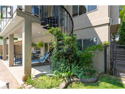 Access from main level sundeck to backyard at 2233 Quail Run Drive, University District, Kelowna