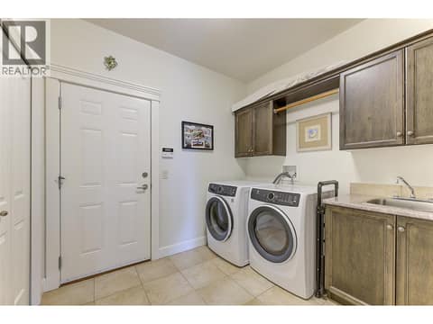 Mud Room / Laundry with Sink and lots of storage at 2233 Quail Run Drive, University District, Kelowna