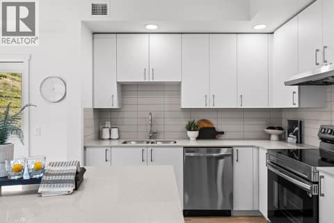 Kitchen. Photos may be of a similar home in the community. at 1057 Frost Road Unit# 118, Upper Mission, Kelowna
