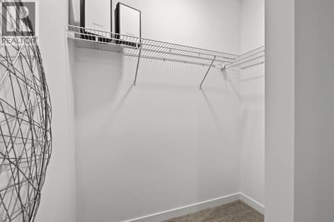 Primary Walk-in Closet. Photos may be of a similar home in the community. at 1057 Frost Road Unit# 118, Upper Mission, Kelowna