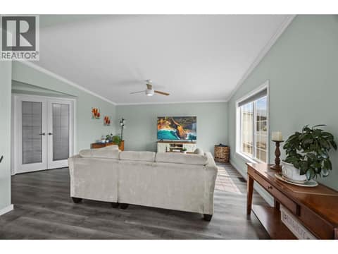 A surprisingly spacious living room with vaulted ceiling, abundant natural light and plenty of room for full-size furnishings. at 9020 Jim Bailey Road Unit# 151, Lake Country East / Oyama, Kelowna
