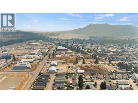 Aerial perspective showing the surrounding community and its proximity to nearby amenities and the natural beauty of the Okanagan. at 9020 Jim Bailey Road Unit# 151, Lake Country East / Oyama, Kelowna