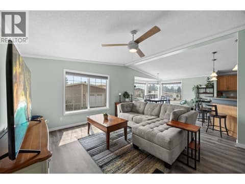 Another great view of the spacious living area and its seamless connection to the dining room and kitchen, creating an open, airy feel throughout the heart of the home. at 9020 Jim Bailey Road Unit# 151, Lake Country East / Oyama, Kelowna