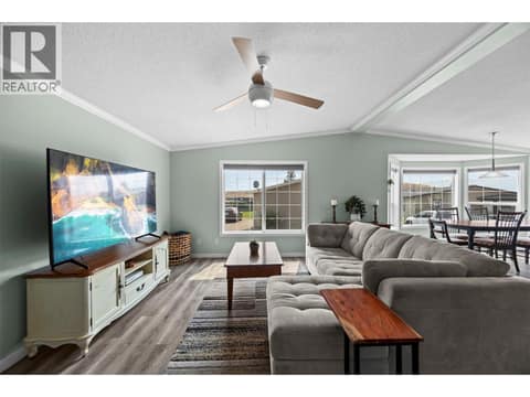 Bright and inviting living room with a vaulted ceiling, large windows and plenty of space for comfortable, full-size furnishings. at 9020 Jim Bailey Road Unit# 151, Lake Country East / Oyama, Kelowna