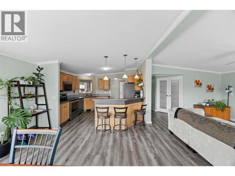 Bright, open-concept living with updated flooring flowing throughout the kitchen, dining and living areas, making the home feel remarkably spacious. at 9020 Jim Bailey Road Unit# 151, Lake Country East / Oyama, Kelowna