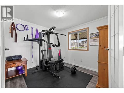 Generously sized third bedroom, currently used as a home gym, offering excellent flexibility as a guest room, home office, hobby room or additional bedroom. at 9020 Jim Bailey Road Unit# 151, Lake Country East / Oyama, Kelowna