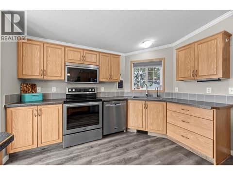 Plenty of room to cook and create, with extensive storage, ample prep space and a window over the sink bringing in natural light. at 9020 Jim Bailey Road Unit# 151, Lake Country East / Oyama, Kelowna