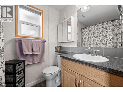 Private ensuite featuring a full tub/shower, generous vanity and natural light from the window. at 9020 Jim Bailey Road Unit# 151, Lake Country East / Oyama, Kelowna