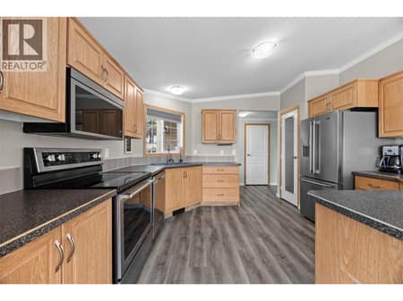 Spacious and exceptionally functional kitchen with abundant cabinetry, generous counter space and updated stainless steel appliances. at 9020 Jim Bailey Road Unit# 151, Lake Country East / Oyama, Kelowna