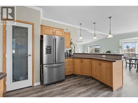 Thoughtfully designed for everyday living with additional cabinetry, a French-door refrigerator, convenient pantry and an open connection to the main living areas. at 9020 Jim Bailey Road Unit# 151, Lake Country East / Oyama, Kelowna