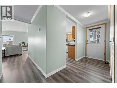 Welcoming entry with updated flooring and an easy flow into both the kitchen and main living area. at 9020 Jim Bailey Road Unit# 151, Lake Country East / Oyama, Kelowna