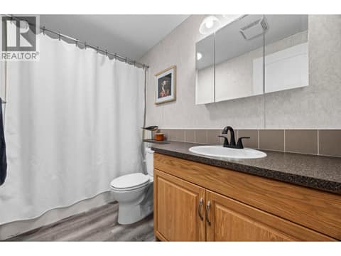 Well-appointed main bathroom with a full tub/shower, generous vanity and plenty of storage, conveniently located for family and guests. at 9020 Jim Bailey Road Unit# 151, Lake Country East / Oyama, Kelowna
