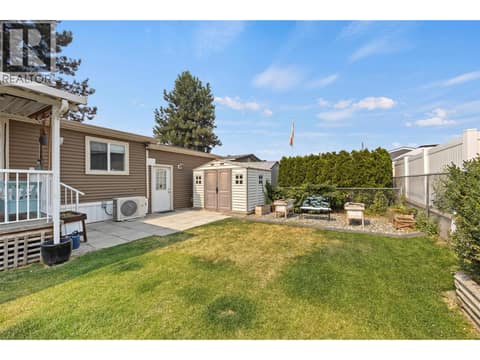 Well-maintained outdoor space with a large storage shed, established hedging and garden areas. at 9020 Jim Bailey Road Unit# 151, Lake Country East / Oyama, Kelowna