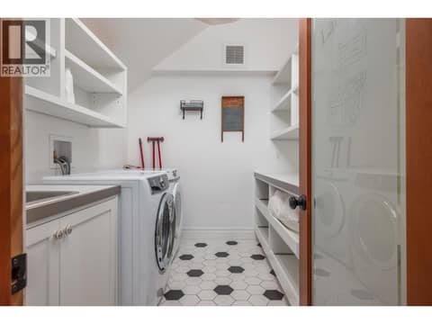 Great big laundry on bedroom level with tons of storage at 2501 30 Avenue, East Hill, Vernon