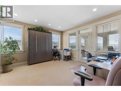 Main Floor 2nd Bedroom with Murphy Bed + Armoire at 1095 Hume Avenue, Black Mountain, Kelowna