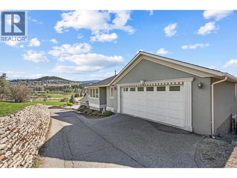 Upper Level Double Garage with paved driveway at 1095 Hume Avenue, Black Mountain, Kelowna