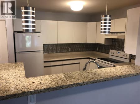 Kitchen with Open View to dining and living room. at 400 Sutton Crescent Unit# 310 Lot# 42, North Glenmore, Kelowna