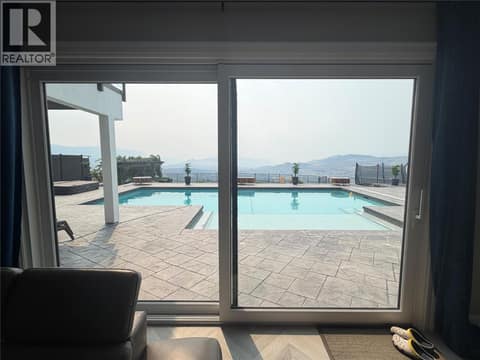 Access to pool deck from family room at 628 Hart Place, Foothills, Vernon