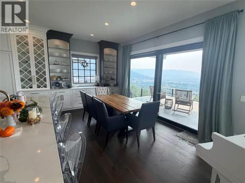 Dining room with access to covered deck at 628 Hart Place, Foothills, Vernon