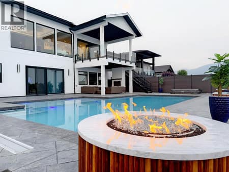 Enjoy the views of the inground swimming pool at 628 Hart Place, Foothills, Vernon