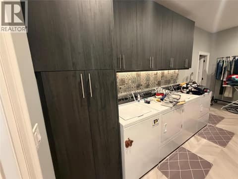 Laundry in basement, note double machines at 628 Hart Place, Foothills, Vernon