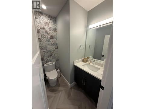 Powder room basement level at 628 Hart Place, Foothills, Vernon