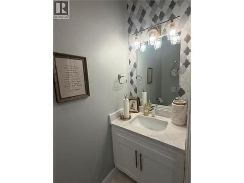 Powder room main level at 628 Hart Place, Foothills, Vernon