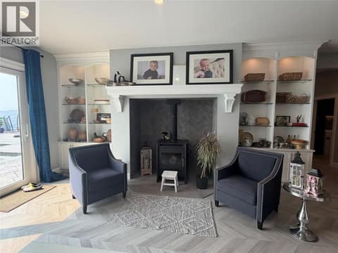 Wood burning stove in family room at 628 Hart Place, Foothills, Vernon