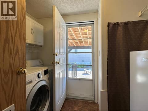 Laundry and patio access at 12560 Westside Road Unit# 26, Swan Lake West, Vernon