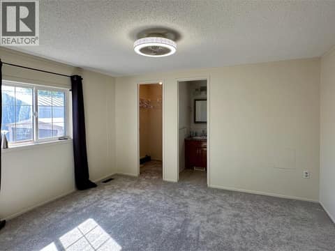 Primary bedroom with ensuite and walk in closet at 12560 Westside Road Unit# 26, Swan Lake West, Vernon
