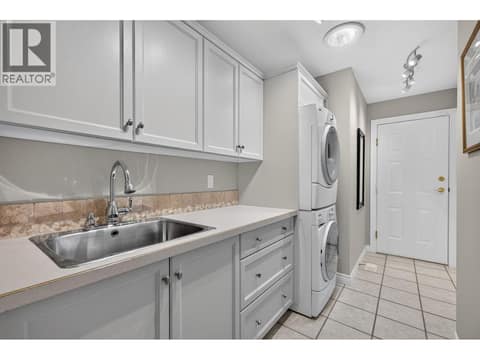 Large Laundry - plenty of storage at 3901 Gallaghers Circle, South East Kelowna