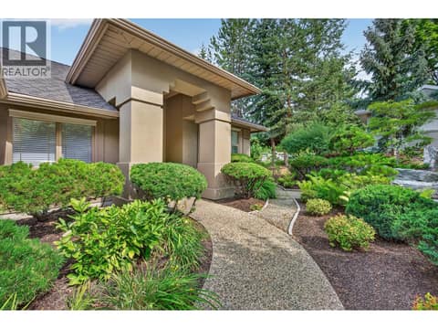 Manicured landscape creates privacy at 3901 Gallaghers Circle, South East Kelowna