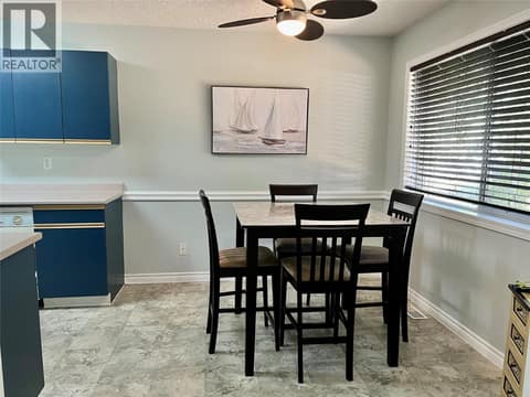 Kitchen eating area looks out onto front yard at 1902 46 Avenue Unit# 2, Harwood, Vernon