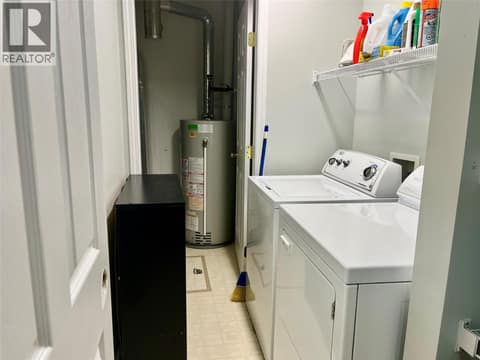 Laundry with mechanical room at back that hold Heat Pump and HW tank at 1902 46 Avenue Unit# 2, Harwood, Vernon