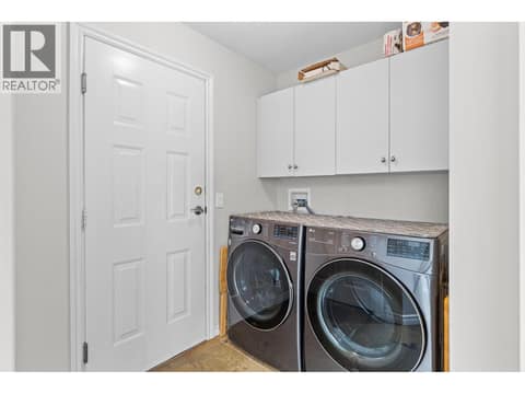 Main floor laundry and entrance to garage. at 4400 Gallaghers Drive E Unit# 2, South East Kelowna