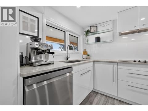 In-law suite kitchen with views from the sink at 3491 Fenton Road, Glenrosa, West Kelowna