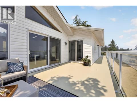 Large deck with access from several rooms at 3491 Fenton Road, Glenrosa, West Kelowna
