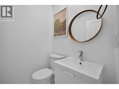 Powder room on the main level at 3491 Fenton Road, Glenrosa, West Kelowna