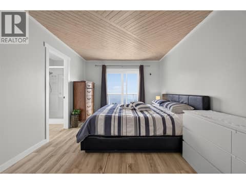 Primary bedroom with insane views at 3491 Fenton Road, Glenrosa, West Kelowna