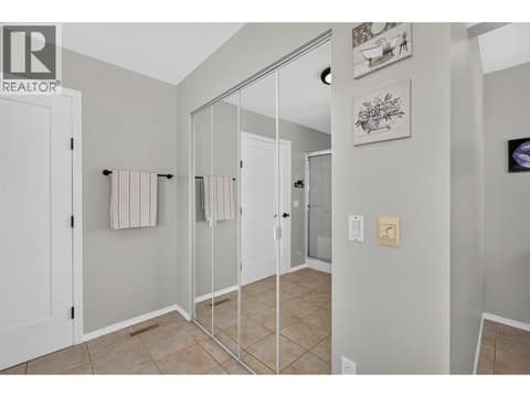 Primary ensuite with soaker tub & a walk-in shower at 3491 Fenton Road, Glenrosa, West Kelowna