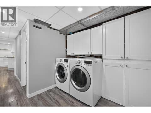 Side by side laundry on the lower level at 3491 Fenton Road, Glenrosa, West Kelowna