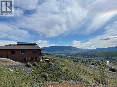 View across vineyards to the hills in the distance at 595 Vineyard Way N Unit# 33, Bella Vista, Vernon